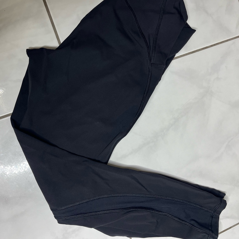 Lululemon black leggings size 6 with mesh on the sides of the leg legs